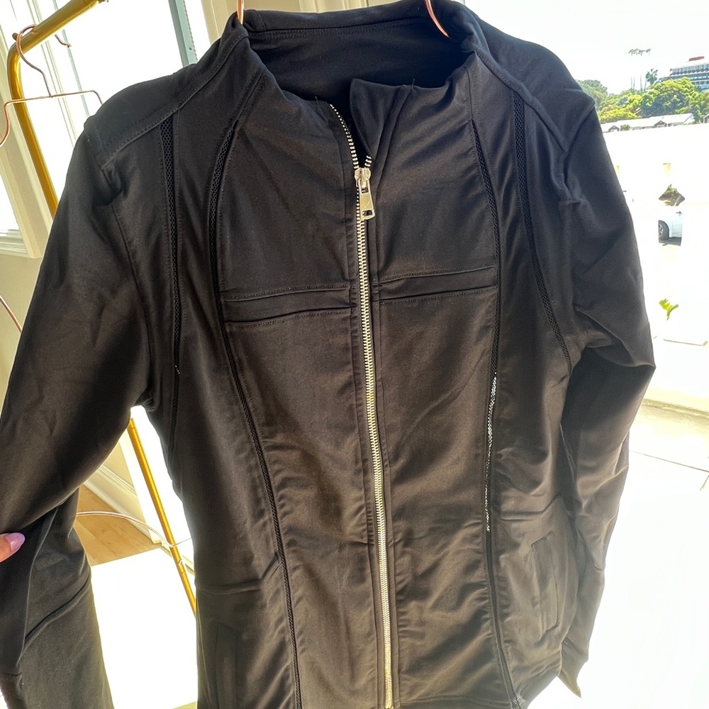 Black athletic jacket with silver slipper
